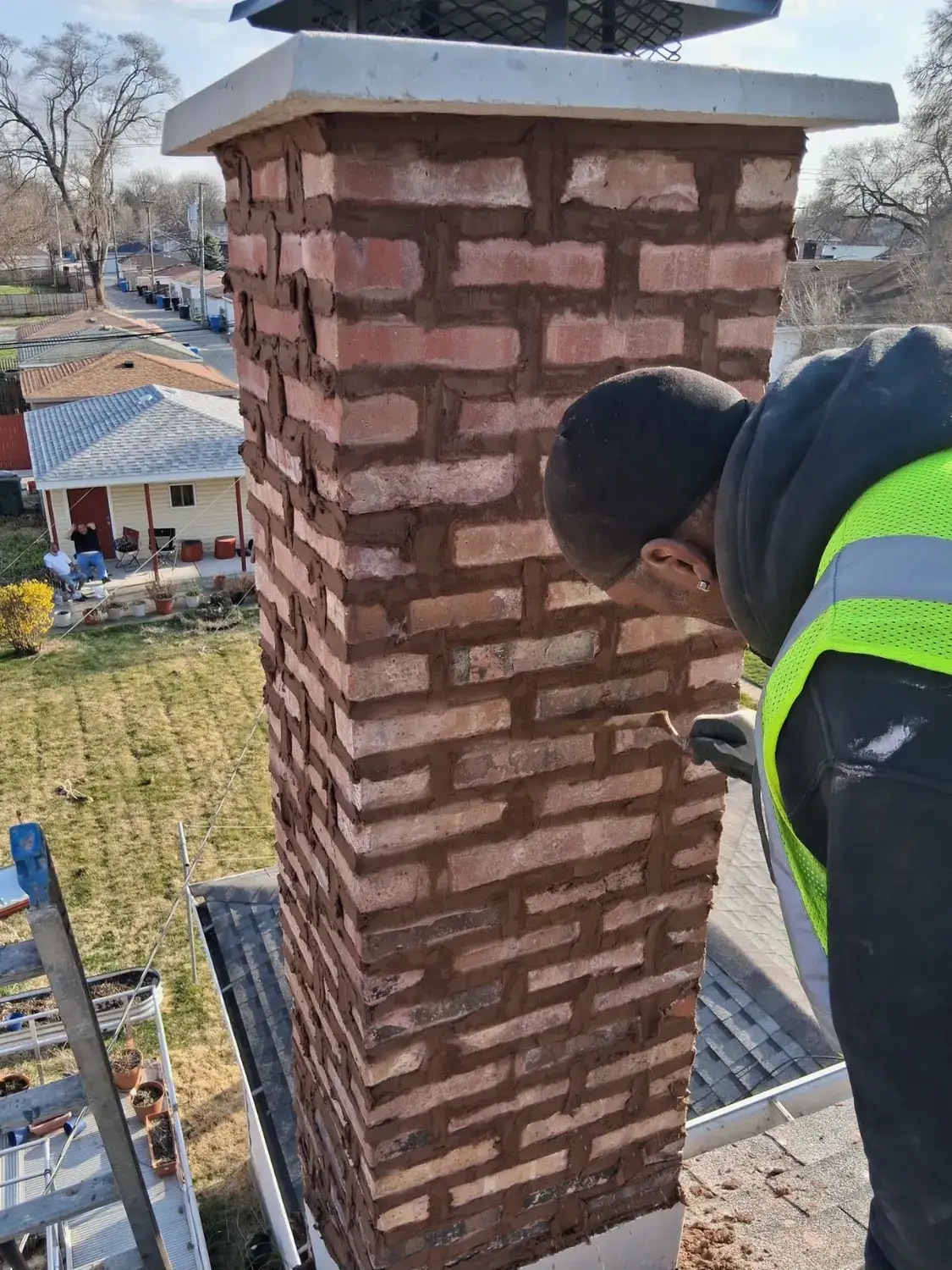 Finished chimney with new crown and cap seen from roof level